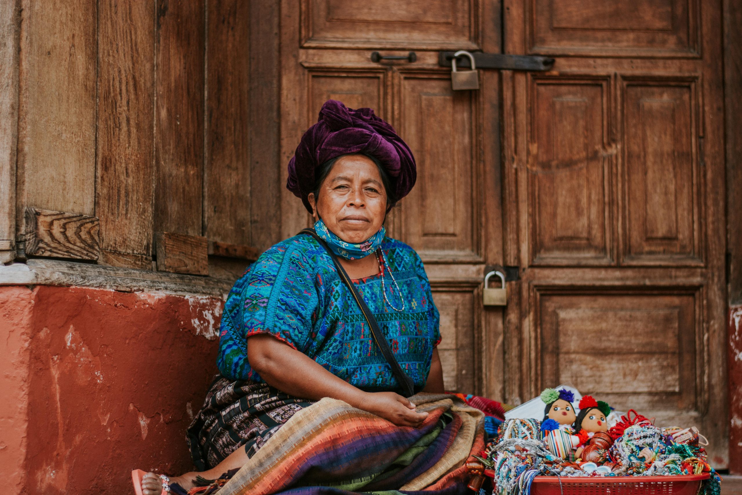 xinka grandmother sitting in front of a building